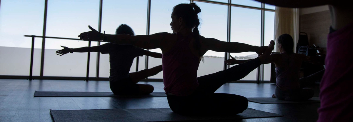 A woman in a yoga class